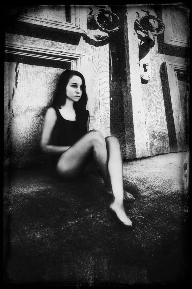 Thoughtful Woman By Door by Desislava Ignatova — canvas wall art