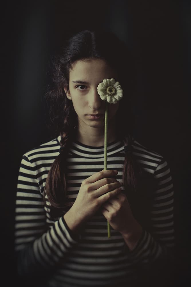 Pensive Girl With Daisy by Svetlana Bekyarova — canvas wall art