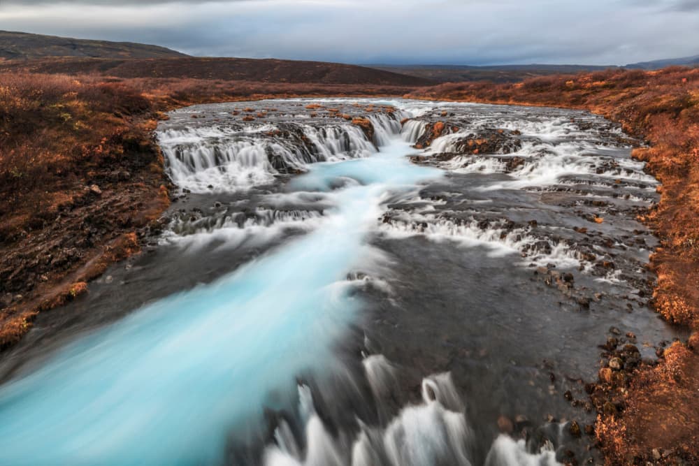 Blue River Waterfalls by Bragi Ingibergsson - BRIN — canvas wall art