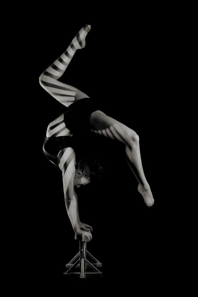 Striped Acrobat Handstand by Howard Ashton-Jones — canvas wall art