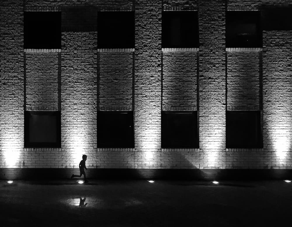 Running Child Silhouette by Huib Limberg — canvas wall art