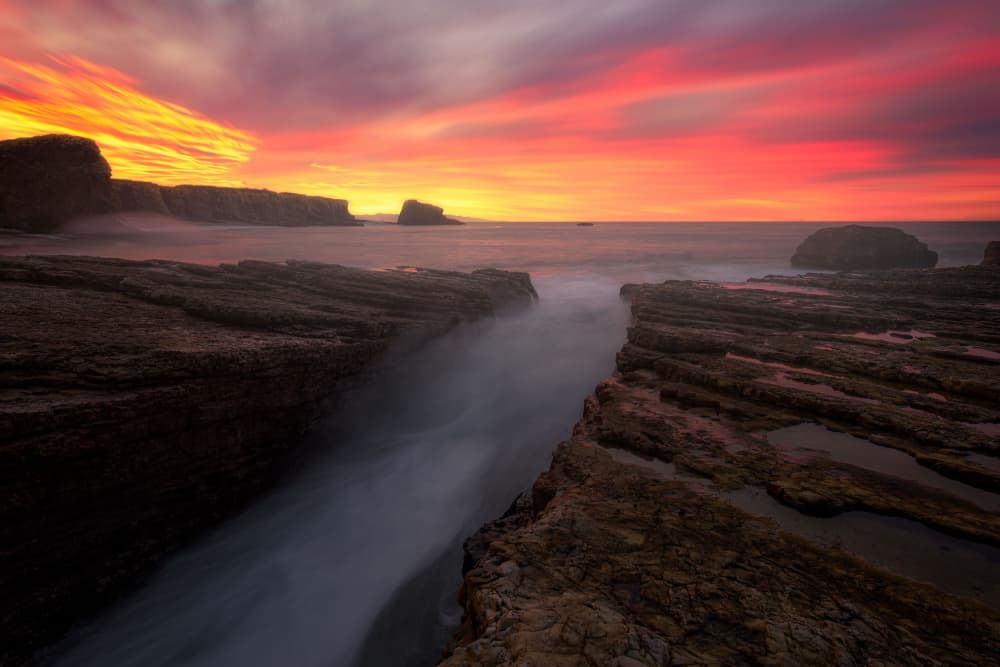 Dramatic Coastal Sunset by Johnny Zhang — canvas wall art
