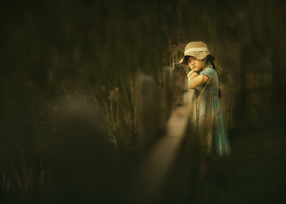 Pensive Girl in Grass by Despird Zhang — canvas wall art