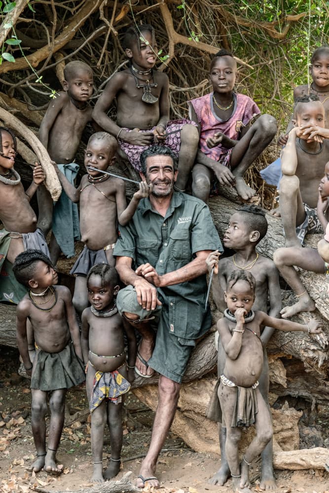 Man with Tribal Children by Trevor Cole — canvas wall art