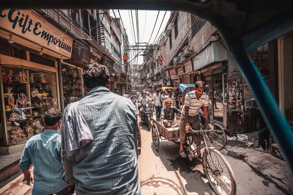 Bustling Indian Street by Marco Tagliarino — canvas wall art