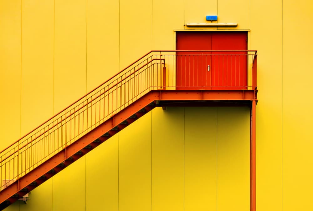 Vibrant Yellow Red Staircase by Hans-Wolfgang Hawerkamp — canvas wall art