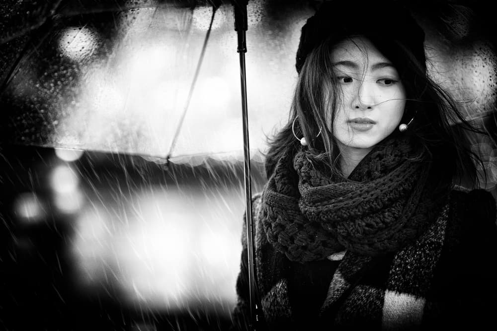 Pensive Under Umbrella by Daisuke Kiyota — canvas wall art