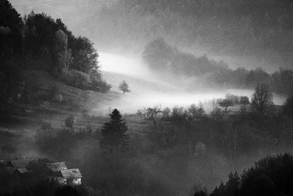 Misty Mountain Village by Karol Važan — canvas wall art