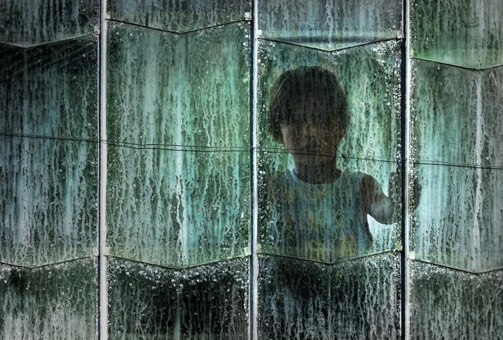 Child Through Rainy Window by Wim Schuurmans — canvas wall art