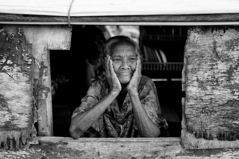 Thoughtful Woman Window by Kieron Long — canvas wall art