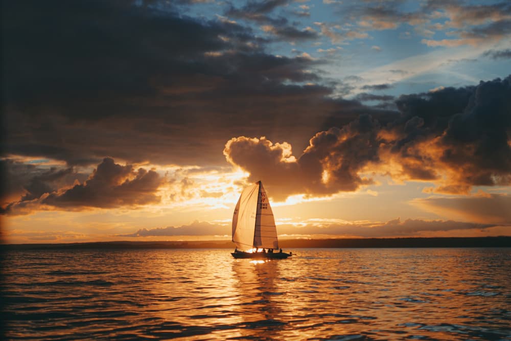Serene Sailboat Sunset by Jana Julian — canvas wall art