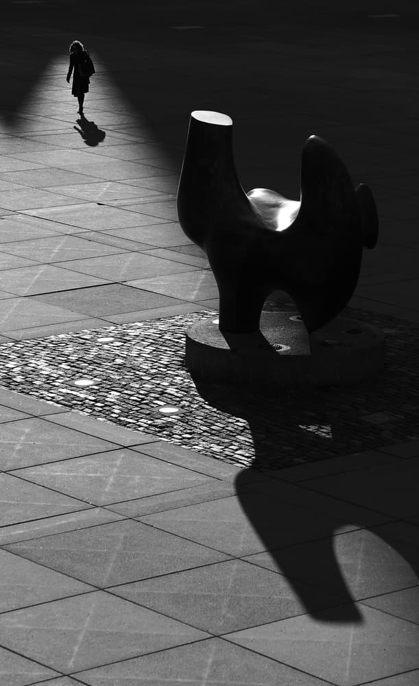 Solitary Walker and Sculpture by Jian Wang — canvas wall art