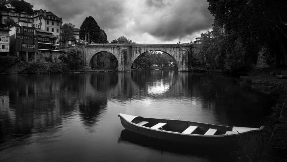 Boat Under Stone Bridge by Gonçalo Capitão — canvas wall art