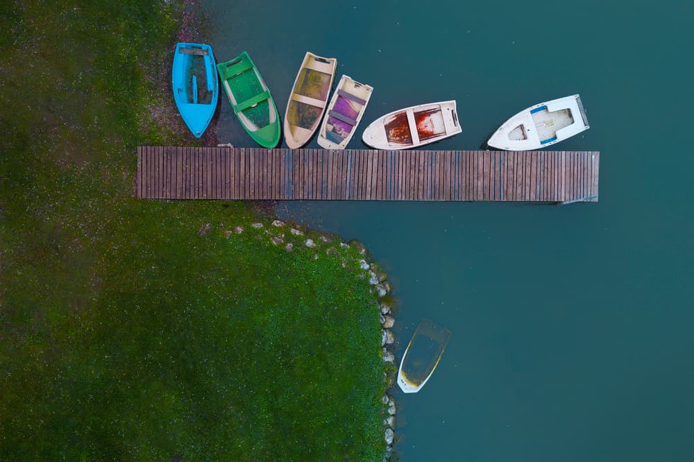 Colorful Docked Boats by Jure Kravanja — canvas wall art