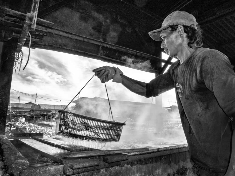 Working Man Steaming Fish by Antonyus Bunjamin (Abe) — canvas wall art