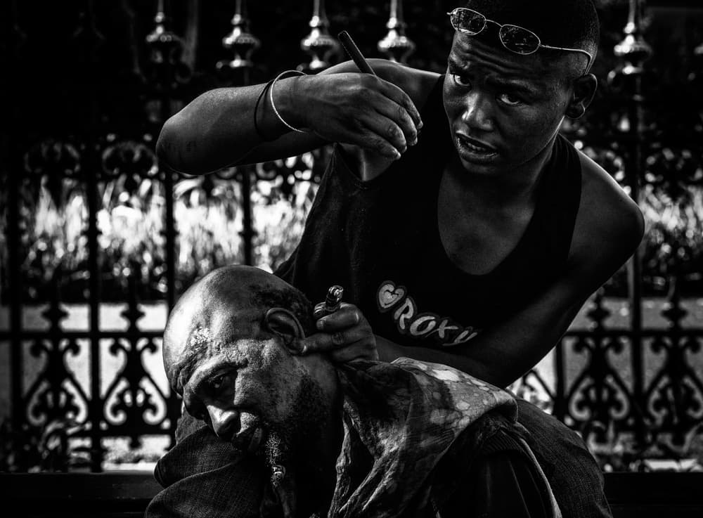 Focused Street Barber by Joxe Inazio Kuesta Garmendia — canvas wall art