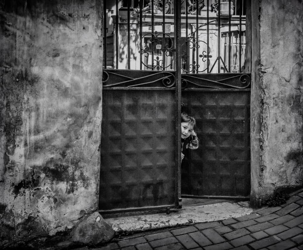 Curious Boy Peeking by Ömer Ates Kızıltug — canvas wall art
