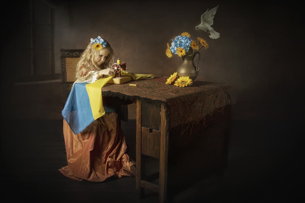 Girl Sewing Ukrainian Flag by Carola Kayen-Mouthaan — canvas wall art