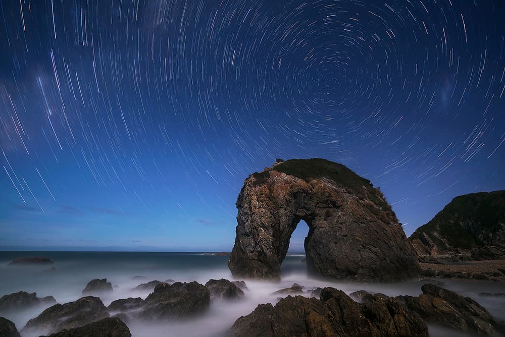Star Trails Ocean Arch by Jingshu Zhu — canvas wall art