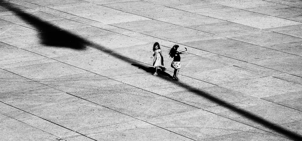 Two Girls Shadow Play by Jian Wang — canvas wall art