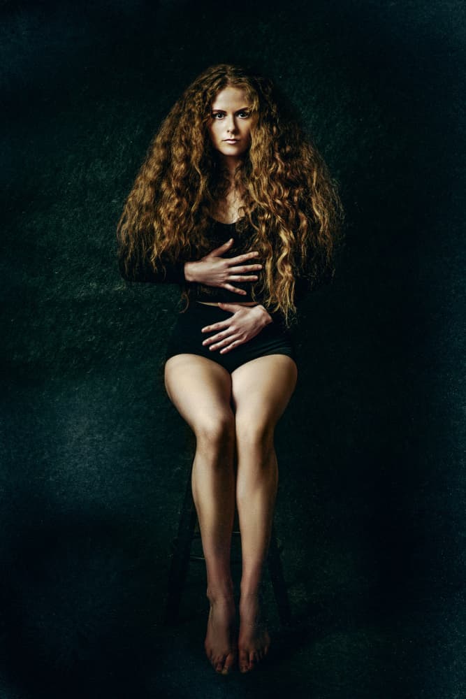Curly Haired Woman by Ruslan Bolgov — canvas wall art
