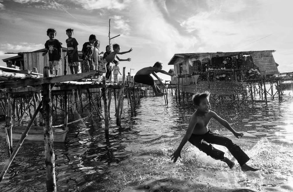 Joyful Village Jump by John Yuk Kong Chung — canvas wall art