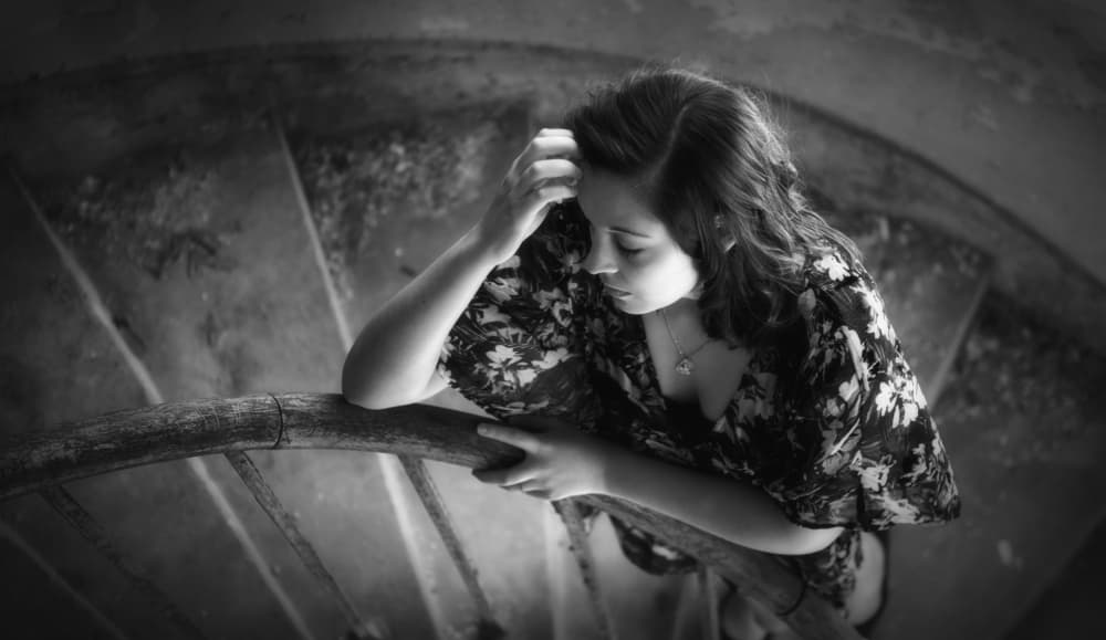 Pensive Woman Spiral Stairs by Georgios Bero — canvas wall art