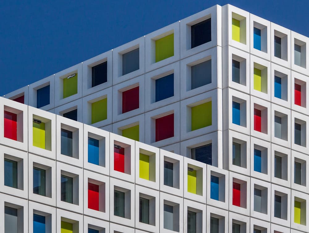 Colorful Geometric Building by Theo Luycx — canvas wall art