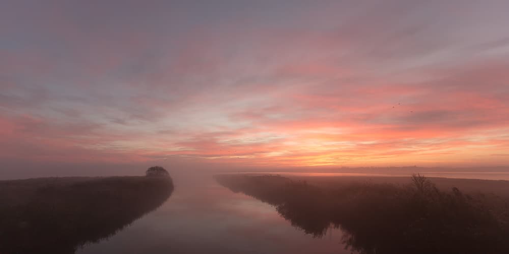 Misty Sunrise River by Leif Løndal — canvas wall art