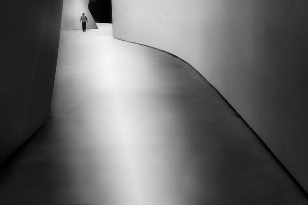 Man In Curved Hallway by Olavo Azevedo — canvas wall art