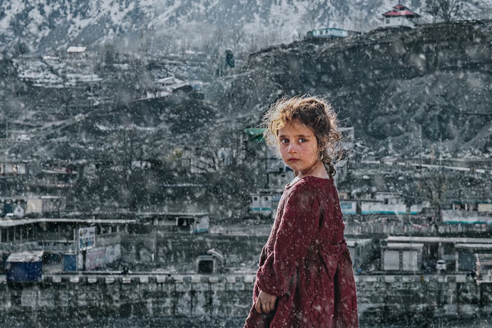 Girl in Snowy Village by Sayyed Nayyer Reza — canvas wall art