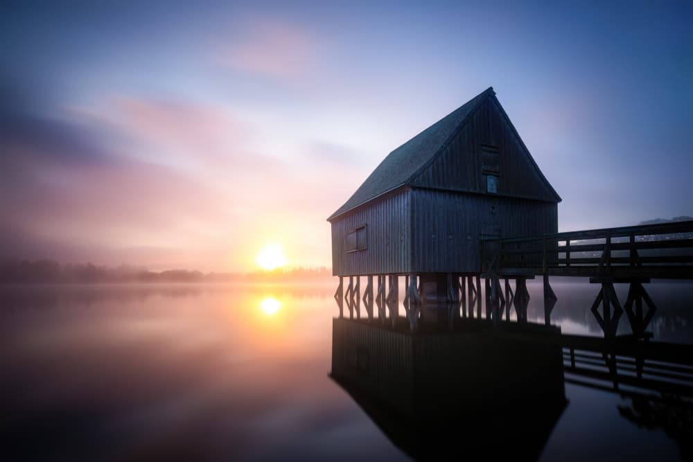 Misty Boathouse Sunrise by Christoph Schaarschmidt — canvas wall art