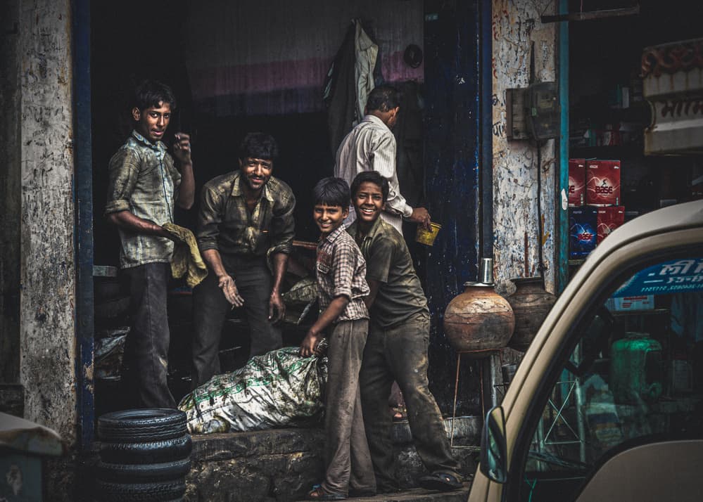 Indian Street Smiles by Marco Tagliarino — canvas wall art