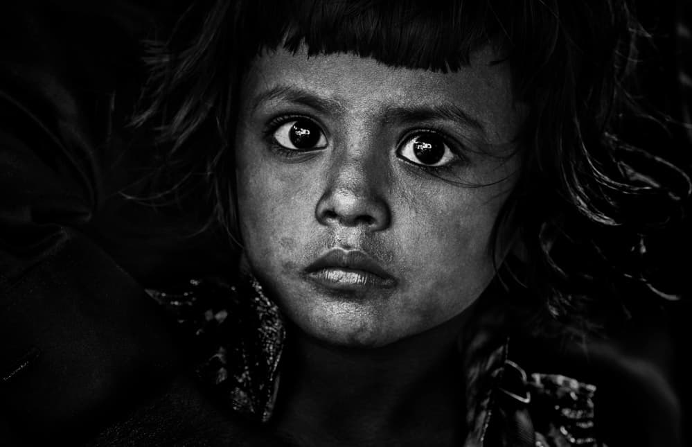 Young Girl's Deep Gaze by Joxe Inazio Kuesta Garmendia — canvas wall art