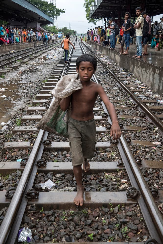 Barefoot Boy on Railway Tracks by Adam Wong — canvas wall art