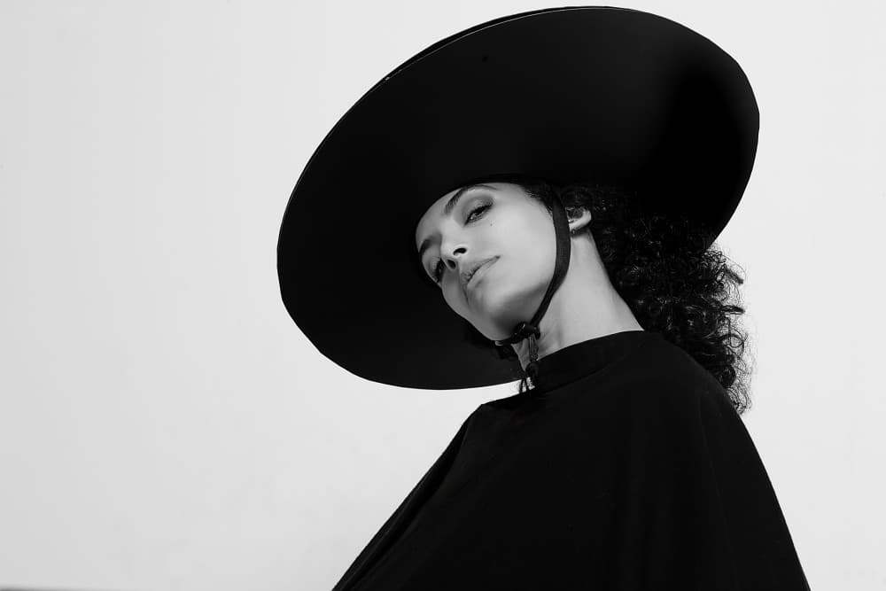 Chic Woman Black Hat by Joan Gil Raga — canvas wall art