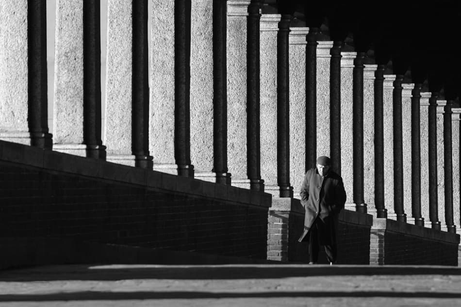 Lone Man Under Columns by Jure Kravanja — canvas wall art