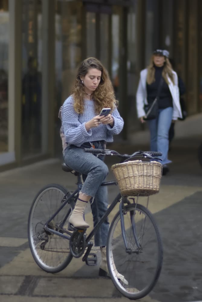 Woman on Bike Phone by Itzik Einhorn — canvas wall art