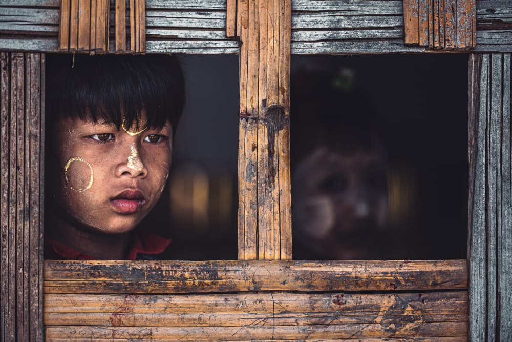 Child in Bamboo Window by Marco Tagliarino — canvas wall art
