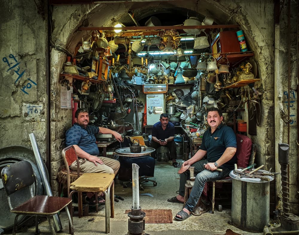 Smiling Market Artisans by Bashar Alsofey — canvas wall art