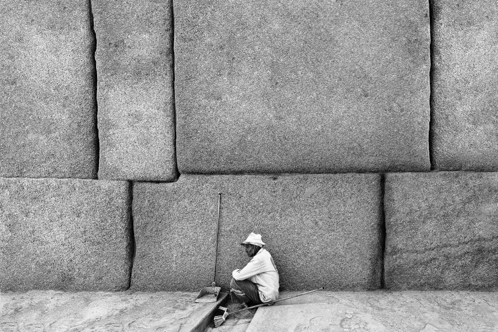 Man Against Stone Wall by Marius Cinteza — canvas wall art
