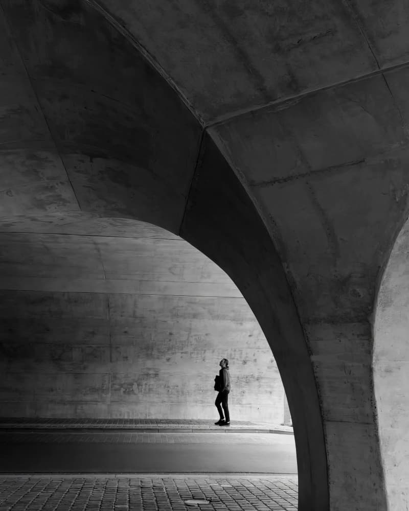 Man Under Concrete Arch by Frank Bruynseraede — canvas wall art