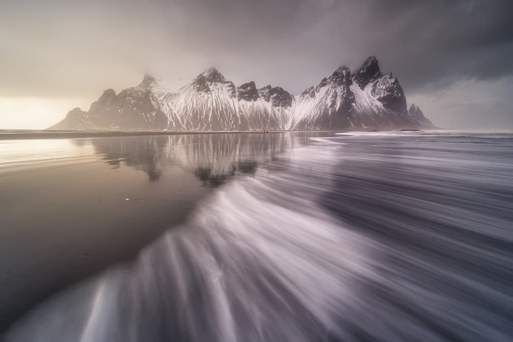 Dramatic Snowy Mountain Reflection by Rodrigo Núñez Buj — canvas wall art