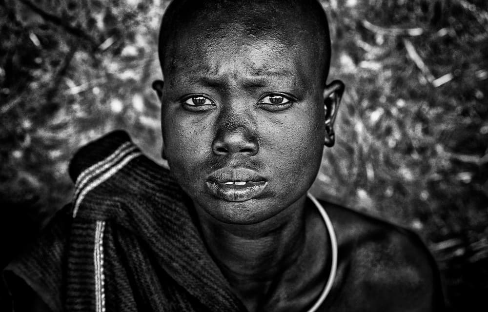 African Youth Gaze by Joxe Inazio Kuesta Garmendia — canvas wall art