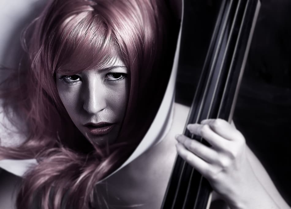 Intense Red-Haired Bassist by Sebastian Kisworo — canvas wall art