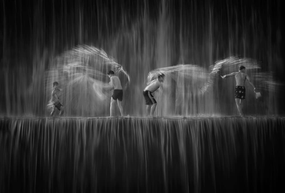 Boys Splashing Water by ANNA AN — canvas wall art