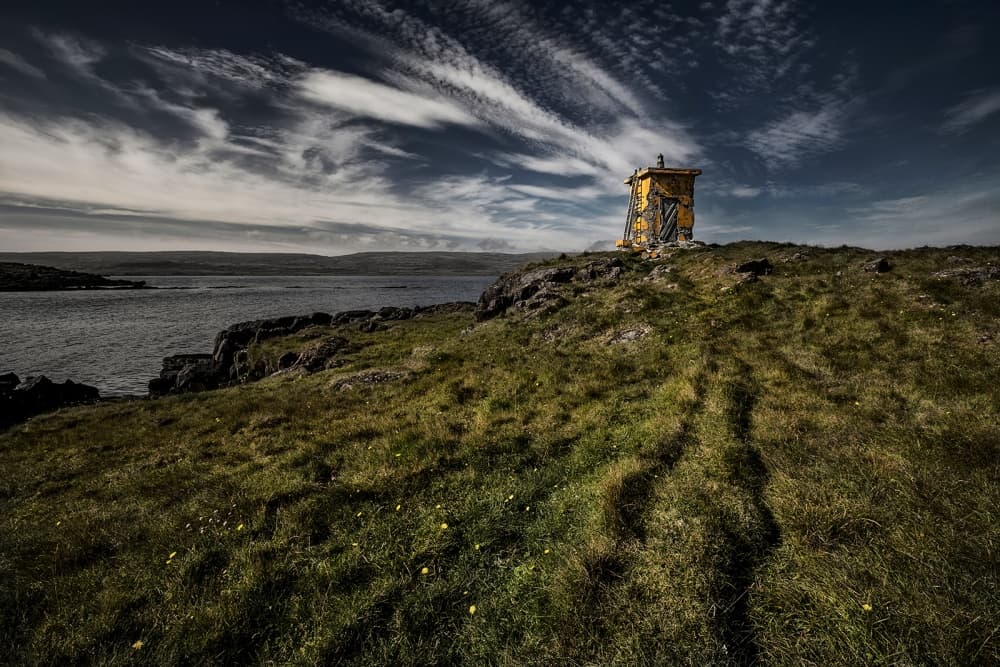 Dramatic Coastal Yellow Hut by Bragi Ingibergsson - BRIN — canvas wall art