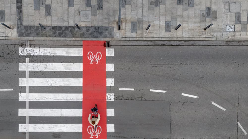Cyclist on Red Path by Primož Kožuh — canvas wall art