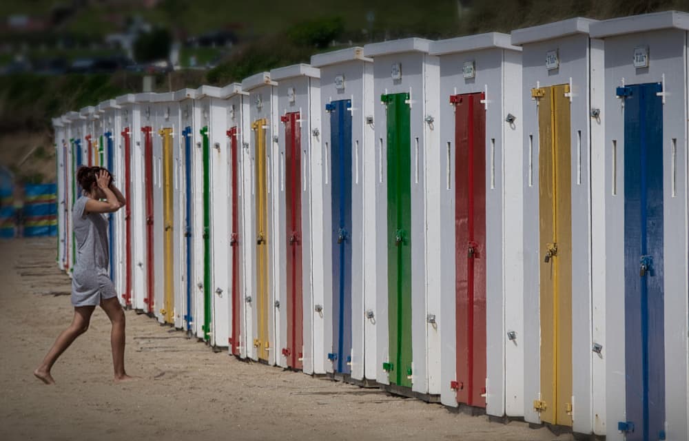 Pensive Beach Hut Walk by Peter Davidson — canvas wall art
