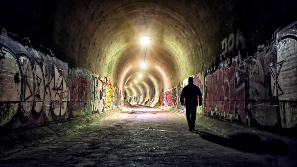 Man In Graffiti Tunnel by Leif Løndal — canvas wall art